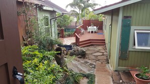 home entrance with original stonework from the 1900's. Outdoor seating.