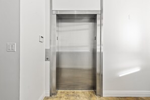 Elevator that opens into unit