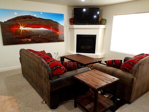 Relax around the fireplace after an exciting day of adventures.