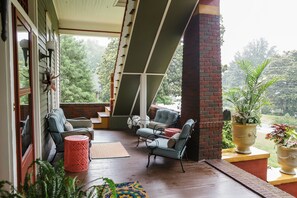 The front porch, perfect for an afternoon visit. Dining area on the other end.