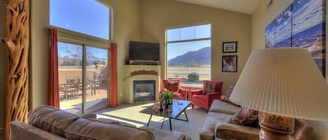 Living room has spectacular views and plenty of comfortable seating