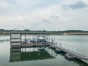 Our private boat dock has two slips and is boat ready!as plenty of space around it for enjoying our kayaks and stand up paddleboards. (Picture taken April 2024)