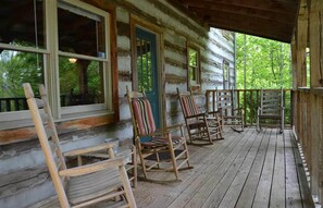 Large front porch with rocking chairs to relax and take in the view of the mtns