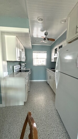 The galley kitchen has all the amenities of home.