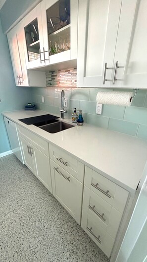 The quartz countertop with sink.
