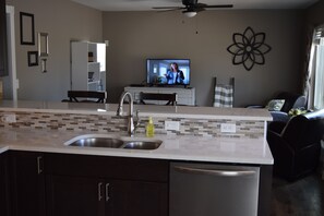 Kitchen looking into living room