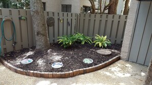 The front patio has a dog friendly area and is fenced in