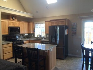 The kitchen has brand new appliances, and granite counter tops. Bar seats 2.