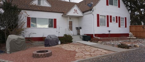 Front view of farm house with fire pit