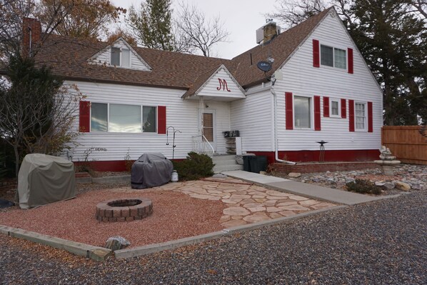 Front view of farm house with fire pit