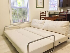 Genuine Leather convertible sofa lays down into King Size bed. Marble floors. 