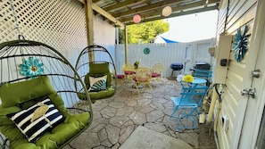 Egg chair swings in the private COVERED back patio