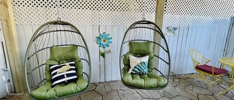 Egg chair swings in the private COVERED back patio