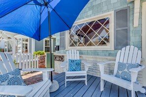 front patio enclosed with white picket fence