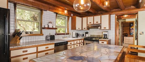 Fully equipped kitchen, charming tile and wood work