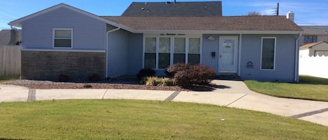 Front of house - 1/2 circular driveway. Fits 2-3 cars and plenty of street pkg.