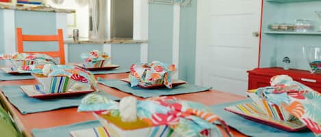 Cheerful area for dining! Colorful dinnerware for enjoying your meals.