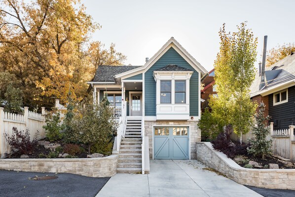 front of house with garage and heated driveway