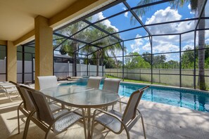 Outdoor Dining table and lounge seating near Pool