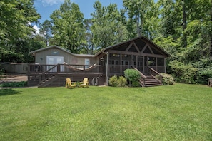 Screened porch, hammock, lawn, everything you need outside of the water