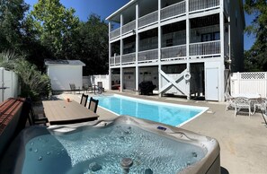 Fenced-in backyard: hottub, salt water pool, grill, seating/lounging