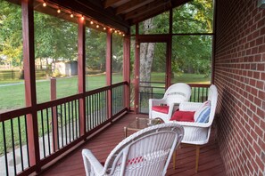 The screened-in porch is the perfect place for morning coffee or to watch the world of nature.