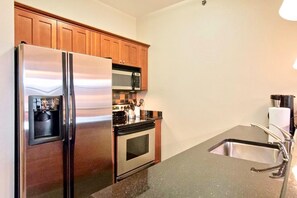 Kitchen with Dishwasher and stocked with Essentials