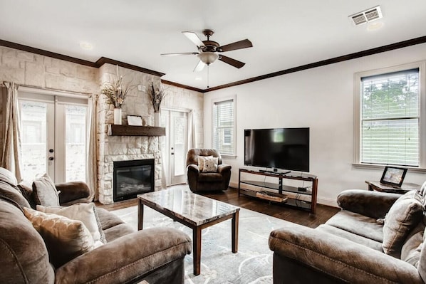 Living Room with Roku TV and Private Balconies