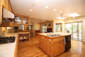 Gourmet kitchen to dining room, backyard great room with wood burning stove