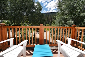 Enjoy a coffee or a glass of wine in these comfy Adirondack chairs with a view!