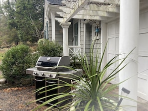 A gas Weber grill is under the pergola for guests to use.  