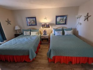 Master Bedroom Featuring Two Queen-Size Beds With Comfortable New Mattresses