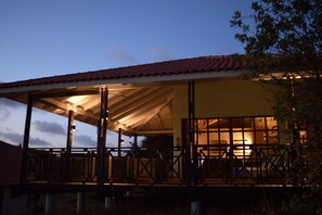 Villa at night with new deck lighting.  
