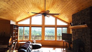 Great room view that really accents the Knotty Pine roof and walls. Large fan.