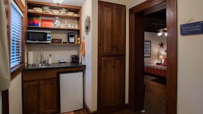 Kitchenette with refrigerator, microwave, toaster, and Keurig coffee maker