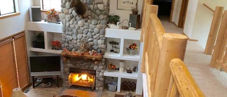  Gather around the 30 foot river rock fireplace! 