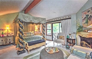 Romantic master suite with fireplace, sitting area and deck