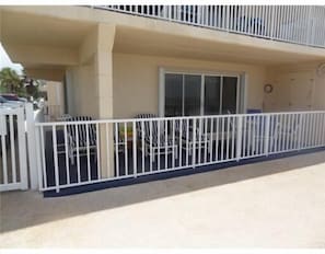 Over sized patio with table, 4 chairs and 4 lounge chairs