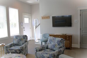 Bright and inviting living space with coastal-inspired décor, plush seating, and modern amenities. Amazon Firestick provided for the Living Room TV.