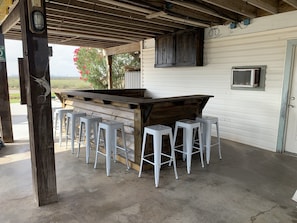 Bar seating and outdoor tv area