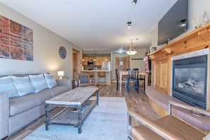 Living Room with gas fireplace, Man Modern furnishings & new flooring throughout