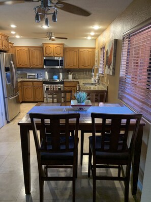 Dinning And Kitchen With Stainless Appliances