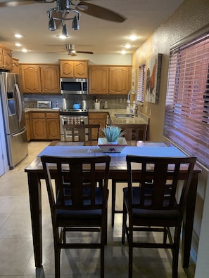 Dinning And Kitchen With Stainless Appliances