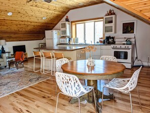 The dining table and kitchen area.