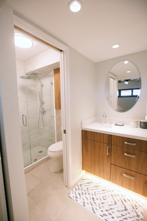 Floating vanity with under cabinet lighting.