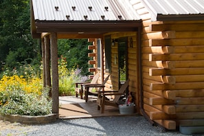 Cabin B covered porch and Adirondack chairs