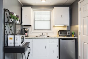 There’s an additional and larger refrigerator for your use in the laundry room.