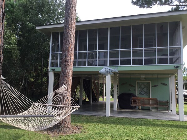 screened in porch facing bayou
