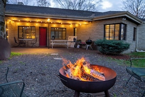 Open Flame Fire Pit -  Fire up a fun party in your private, spacious backyard anytime!