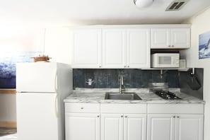 Kitchenette with stove top gas burners